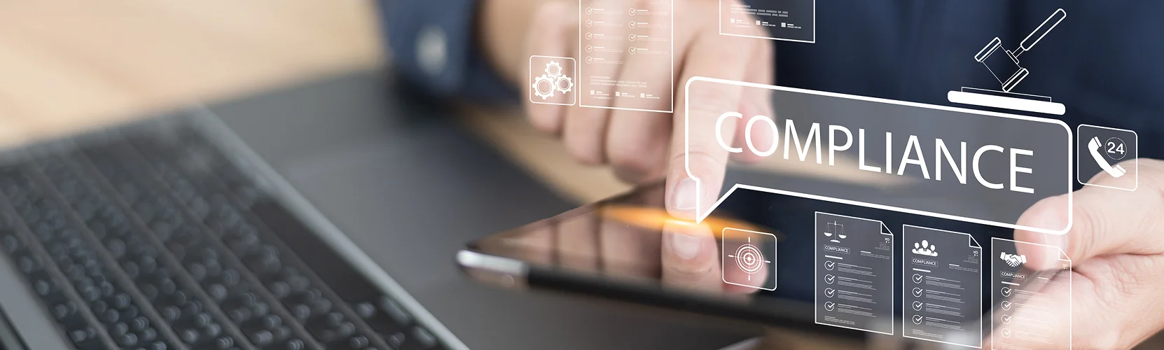 A person uses a tablet near a laptop, with digital icons and the word “COMPLIANCE” overlaid, symbolizing digital compliance and regulation concepts in an advisory and consultancy context.